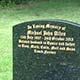 Traditional memorial in polished Emerald Pearl granite Traditional memorial in polished Emerald Pearl granite